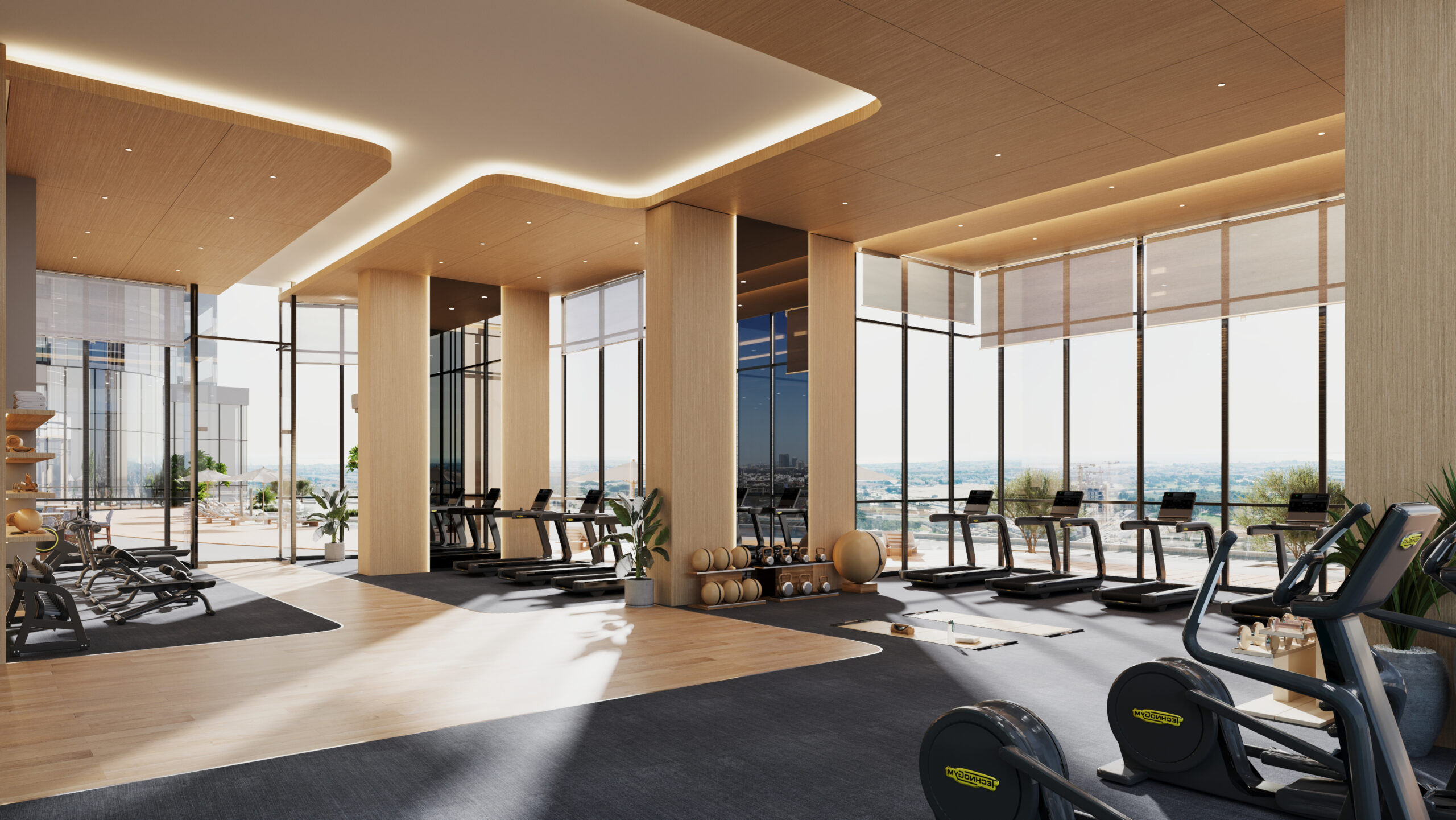 State of the art gym with treadmills, weight lifting equipment and yoga studio adjacent to pool deck